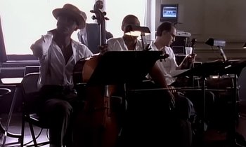 Movie still from “Paula Abdul - Cold Hearted” (1989), directed by David Fincher – Medium shot, Low angle