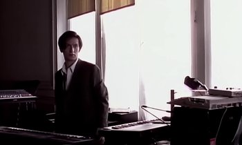 Movie still from “Paula Abdul - Cold Hearted” (1989), directed by David Fincher – Medium shot, Low angle