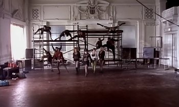 Movie still from “Paula Abdul - Cold Hearted” (1989), directed by David Fincher – Extreme Wide shot, Low angle