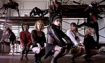 Movie still from “Paula Abdul - Cold Hearted” (1989), directed by David Fincher – Wide shot, Low angle