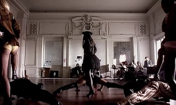 Movie still from “Paula Abdul - Cold Hearted” (1989), directed by David Fincher – Wide shot, Low angle