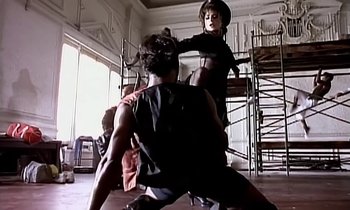 Movie still from “Paula Abdul - Cold Hearted” (1989), directed by David Fincher – Medium shot, Low angle