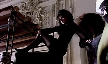 Movie still from “Paula Abdul - Cold Hearted” (1989), directed by David Fincher – Medium shot, Low angle