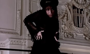 Movie still from “Paula Abdul - Cold Hearted” (1989), directed by David Fincher – Medium shot, High angle