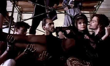 Movie still from “Paula Abdul - Cold Hearted” (1989), directed by David Fincher – Medium shot, High angle