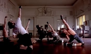 Movie still from “Paula Abdul - Cold Hearted” (1989), directed by David Fincher – Wide shot, Low angle