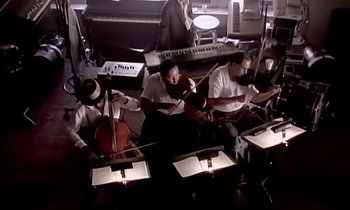 Movie still from “Paula Abdul - Cold Hearted” (1989), directed by David Fincher – Medium shot, High angle