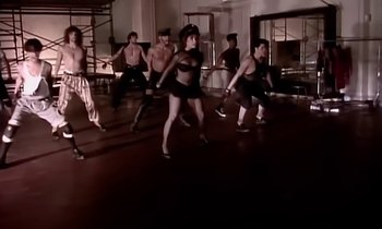 Movie still from “Paula Abdul - Cold Hearted” (1989), directed by David Fincher – Wide shot, High angle