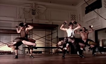 Movie still from “Paula Abdul - Cold Hearted” (1989), directed by David Fincher – Wide shot, Low angle