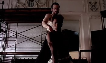 Movie still from “Paula Abdul - Cold Hearted” (1989), directed by David Fincher – Medium shot, Low angle