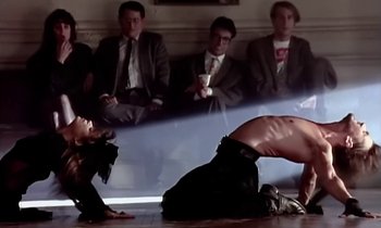 Movie still from “Paula Abdul - Cold Hearted” (1989), directed by David Fincher – Wide shot, Low angle