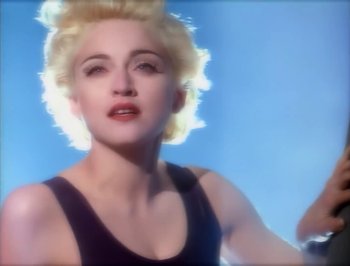 Movie still from “Madonna - Express Yourself” (1989), directed by David Fincher – Close Up shot, Low angle