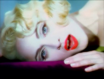 Movie still from “Madonna - Express Yourself” (1989), directed by David Fincher – Extreme Close Up shot, Overhead angle