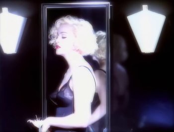 Movie still from “Madonna - Express Yourself” (1989), directed by David Fincher – Close Up shot, Over the shoulder angle