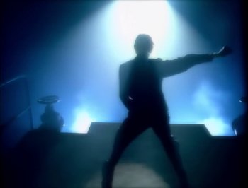 Movie still from “Madonna - Express Yourself” (1989), directed by David Fincher – Medium shot, Low angle