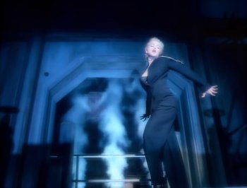 Movie still from “Madonna - Express Yourself” (1989), directed by David Fincher – Medium shot, Low angle
