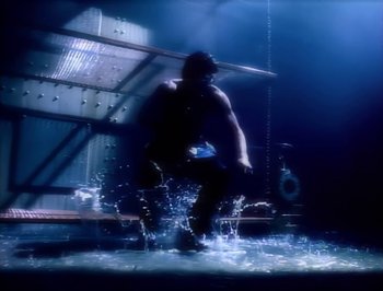 Movie still from “Madonna - Express Yourself” (1989), directed by David Fincher – Wide shot, Low angle