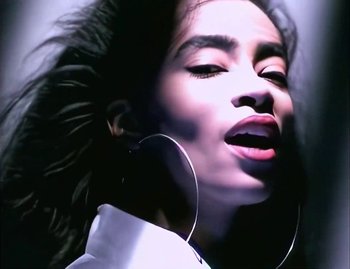 Movie still from “Jody Watley - Real Love” (1989), directed by David Fincher – Extreme Close Up shot, Low angle