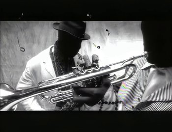 Movie still from “Jody Watley - Real Love” (1989), directed by David Fincher – Extreme Close Up shot, Low angle