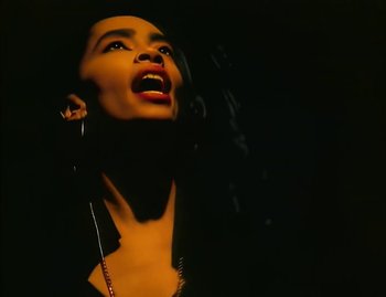 Movie still from “Jody Watley - Real Love” (1989), directed by David Fincher – Close Up shot, Low angle
