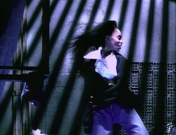 Movie still from “Jody Watley - Real Love” (1989), directed by David Fincher – Medium shot, Low angle