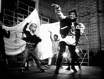 Movie still from “Paula Abdul - Forever Your Girl” (1989), directed by David Fincher – Wide shot, Low angle