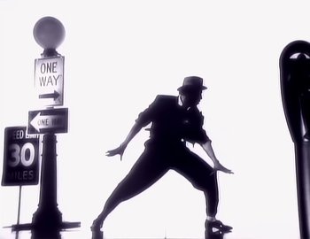 Movie still from “Paula Abdul - Straight Up” (1988), directed by David Fincher – Wide shot, Low angle