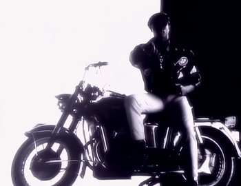 Movie still from “Paula Abdul - Straight Up” (1988), directed by David Fincher – Wide shot, Low angle