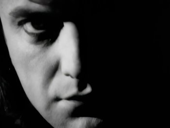 Movie still from “Foreigner - Say You Will” (1987), directed by David Fincher – Extreme Close Up shot, Low angle