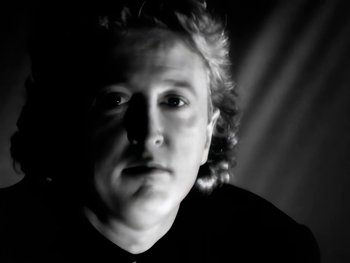 Movie still from “Foreigner - Say You Will” (1987), directed by David Fincher – Close Up shot, Low angle