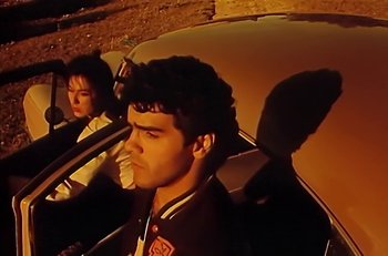 Movie still from “Gipsy Kings - Bamboléo” (1987), directed by David Fincher – Medium shot, Low angle