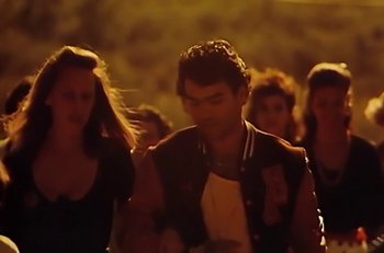 Movie still from “Gipsy Kings - Bamboléo” (1987), directed by David Fincher – Medium shot, Low angle