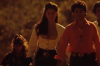 Movie still from “Gipsy Kings - Bamboléo” (1987), directed by David Fincher – Medium shot, Low angle