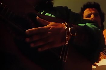 Movie still from “Gipsy Kings - Bamboléo” (1987), directed by David Fincher – Extreme Close Up shot, Low angle