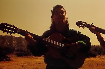 Movie still from “Gipsy Kings - Bamboléo” (1987), directed by David Fincher – Medium shot, Low angle