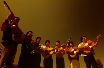 Movie still from “Gipsy Kings - Bamboléo” (1987), directed by David Fincher – Wide shot, Low angle