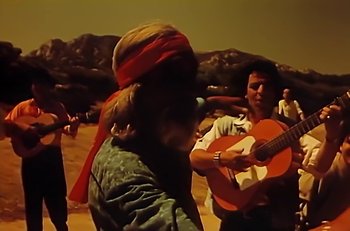Movie still from “Gipsy Kings - Bamboléo” (1987), directed by David Fincher – Medium shot, Low angle