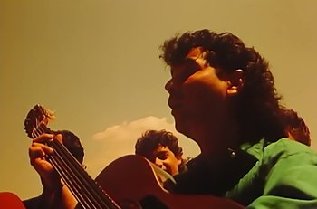 Movie still from “Gipsy Kings - Bamboléo” (1987), directed by David Fincher – Extreme Close Up shot, Low angle