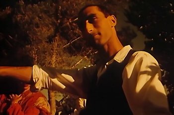 Movie still from “Gipsy Kings - Bamboléo” (1987), directed by David Fincher – Medium shot, Low angle