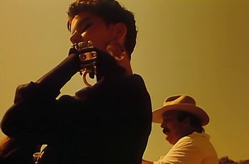 Movie still from “Gipsy Kings - Bamboléo” (1987), directed by David Fincher – Extreme Close Up shot, Low angle