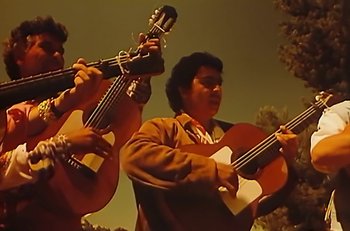 Movie still from “Gipsy Kings - Bamboléo” (1987), directed by David Fincher – Medium shot, Low angle