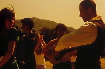 Movie still from “Gipsy Kings - Bamboléo” (1987), directed by David Fincher – Medium shot, Low angle