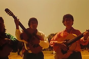Movie still from “Gipsy Kings - Bamboléo” (1987), directed by David Fincher – Medium shot, Low angle