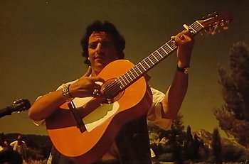 Movie still from “Gipsy Kings - Bamboléo” (1987), directed by David Fincher – Medium shot, Low angle