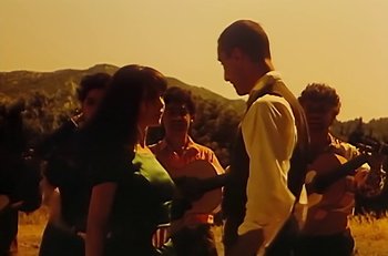 Movie still from “Gipsy Kings - Bamboléo” (1987), directed by David Fincher – Medium shot, Low angle