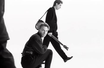 Movie still from “Johnny Hates Jazz - Shattered Dreams” (1987), directed by David Fincher – Medium shot, Low angle