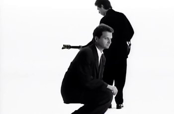 Movie still from “Johnny Hates Jazz - Shattered Dreams” (1987), directed by David Fincher – Medium shot, Low angle