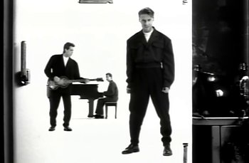 Movie still from “Johnny Hates Jazz - Shattered Dreams” (1987), directed by David Fincher – Medium shot, Low angle