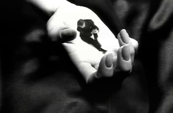 Movie still from “Johnny Hates Jazz - Shattered Dreams” (1987), directed by David Fincher – Extreme Close Up shot, High angle