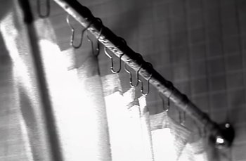 Movie still from “Johnny Hates Jazz - Shattered Dreams” (1987), directed by David Fincher – Extreme Close Up shot, Low angle